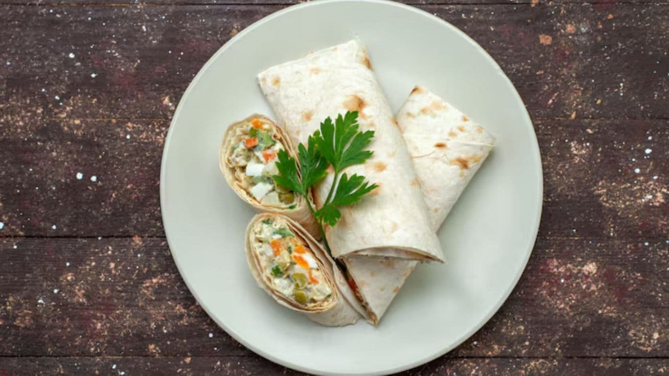 Vegetable wrap with fresh herbs on plate
