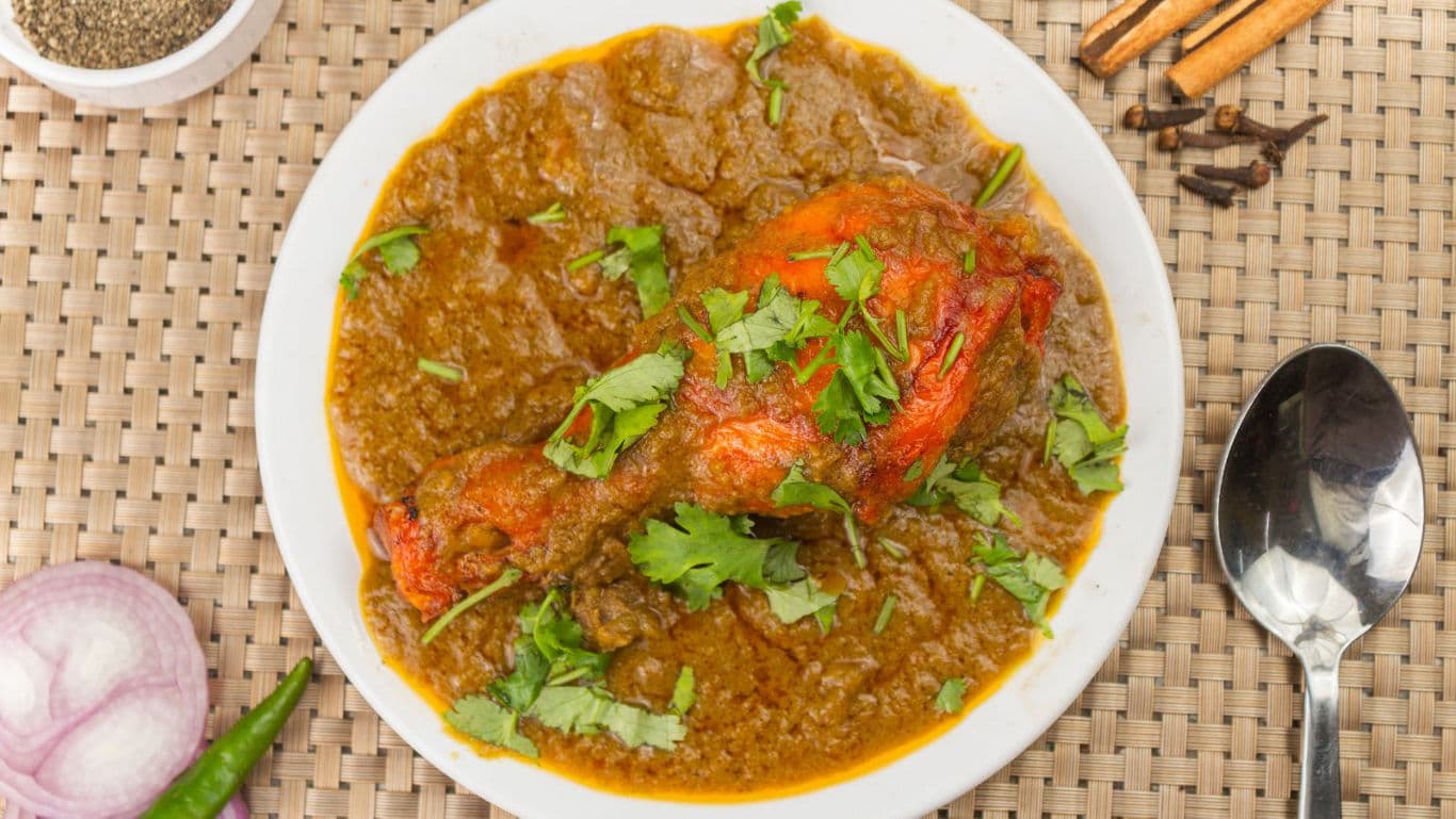 Spicy chicken curry with fresh herbs