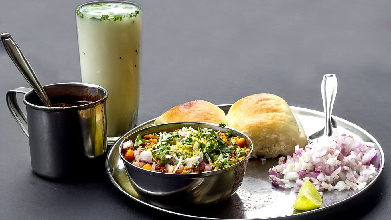 Indian street food platter with beverages