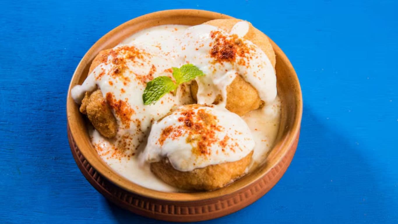 Dahi Vada with Yogurt and Spices in Clay Bowl