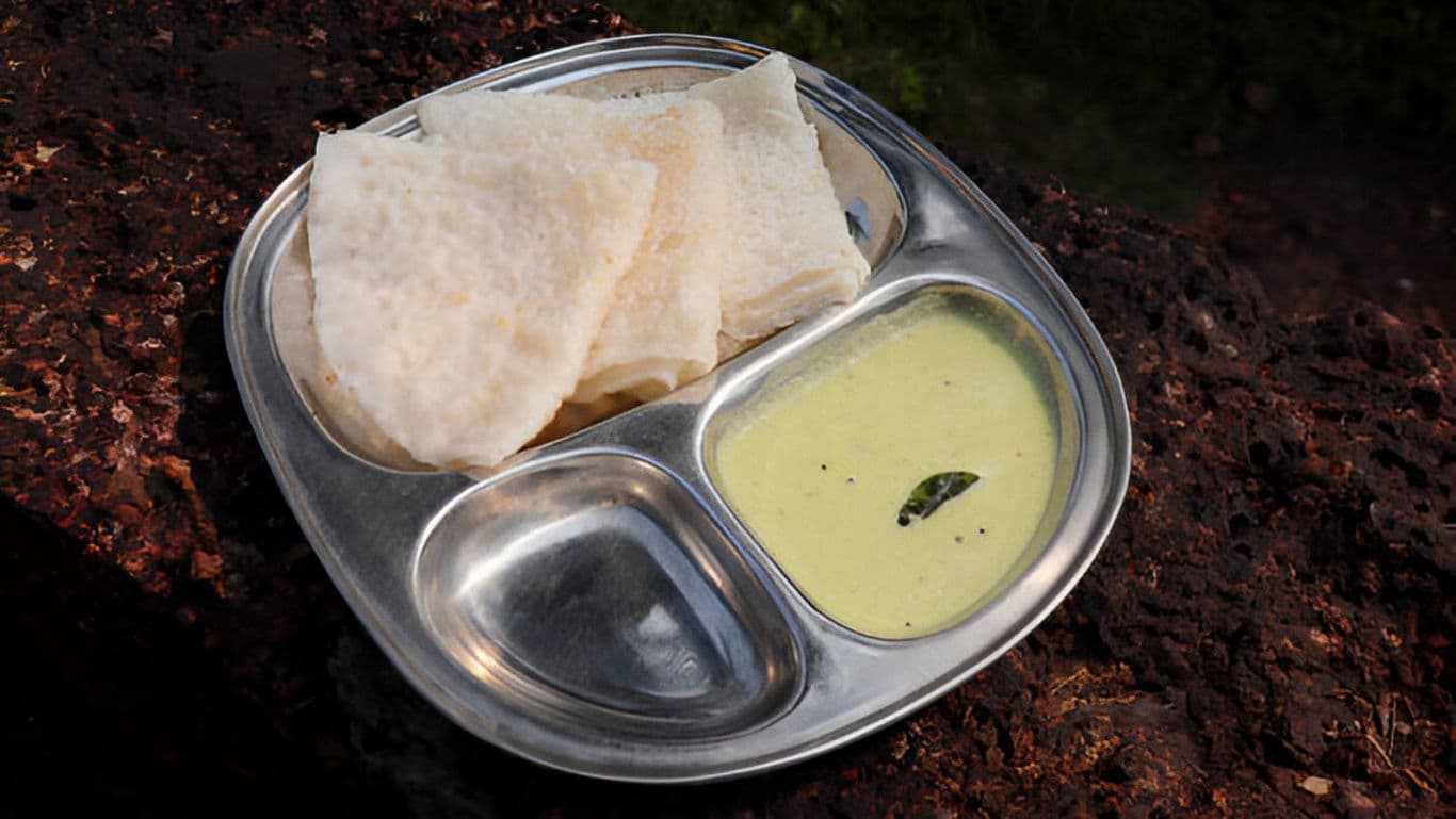 Traditional South Indian breakfast with chutney outdoors