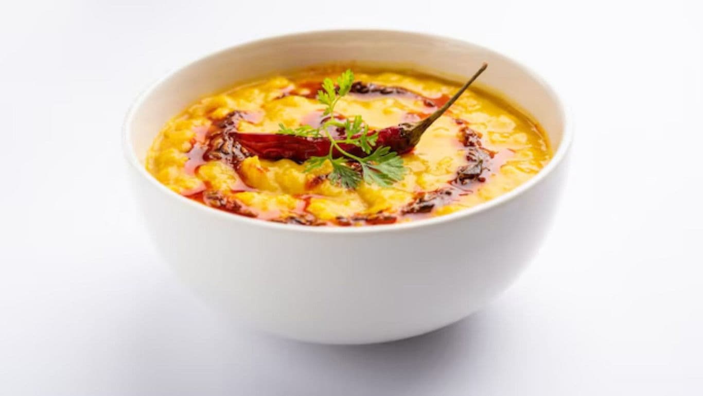 White bowl of spiced lentil soup