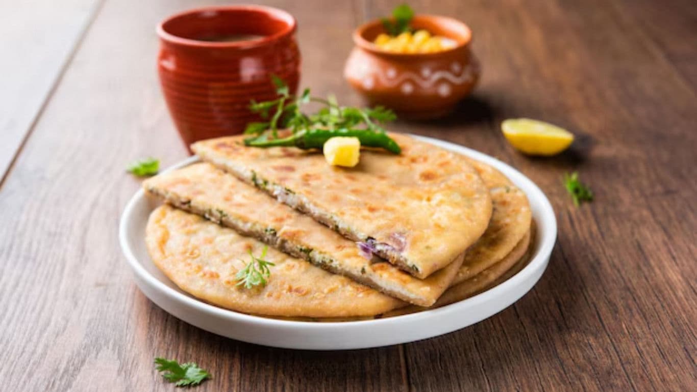 Stuffed flatbread with butter and chutney