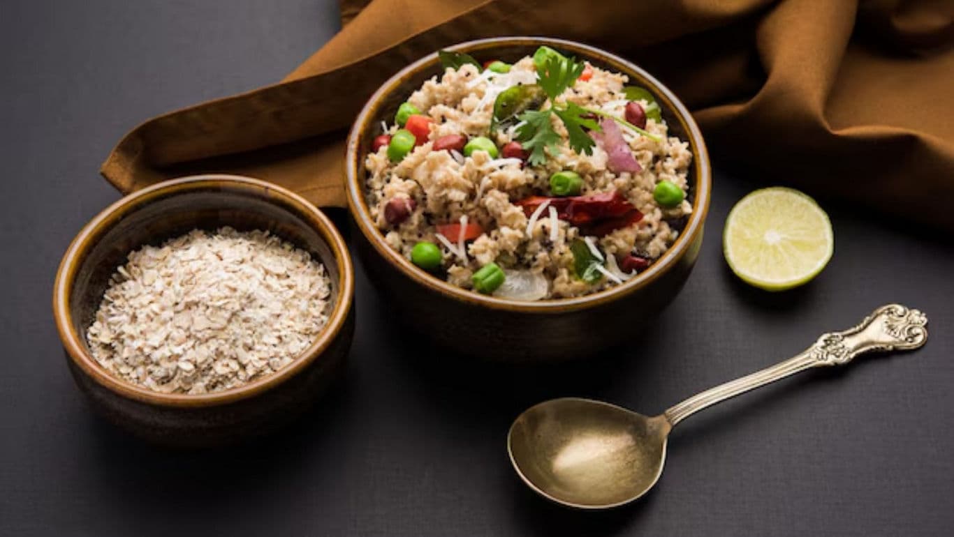 Healthy vegetable oats upma with fresh garnish and lime