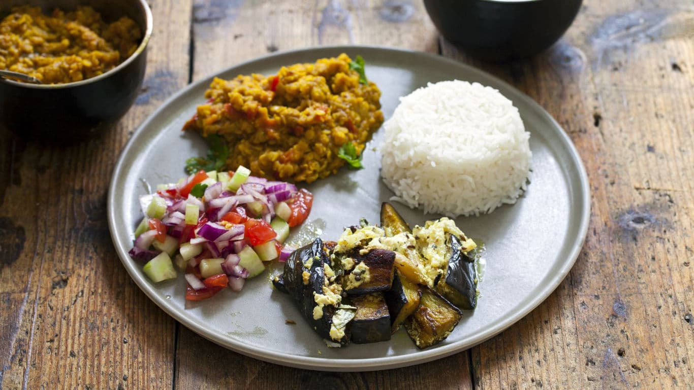 Indian vegetarian meal with rice, dal, and vegetables