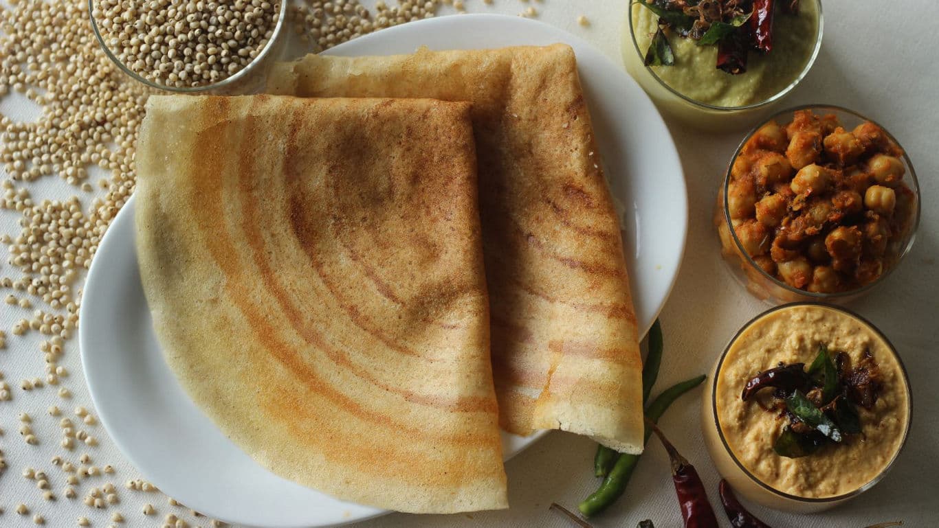 Crispy dosa with assorted Indian sides