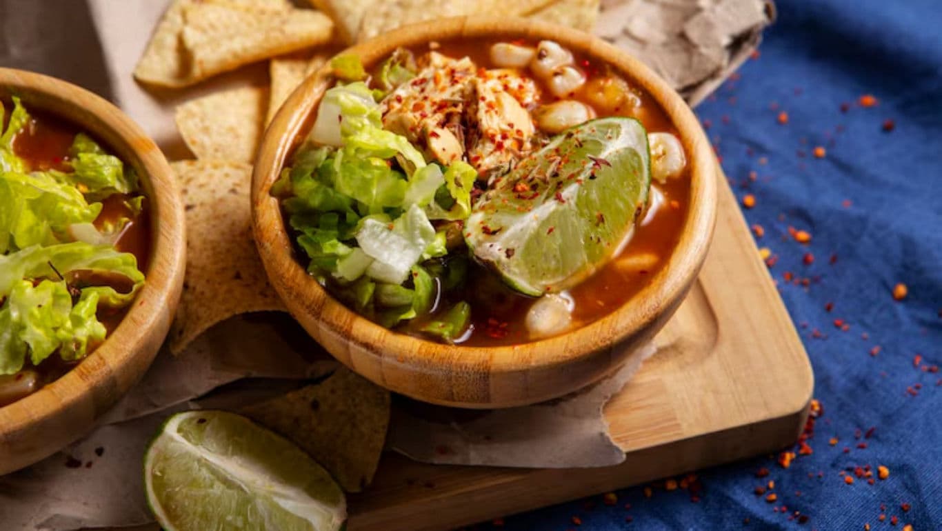 Mexican soup with lime and tortilla chips served