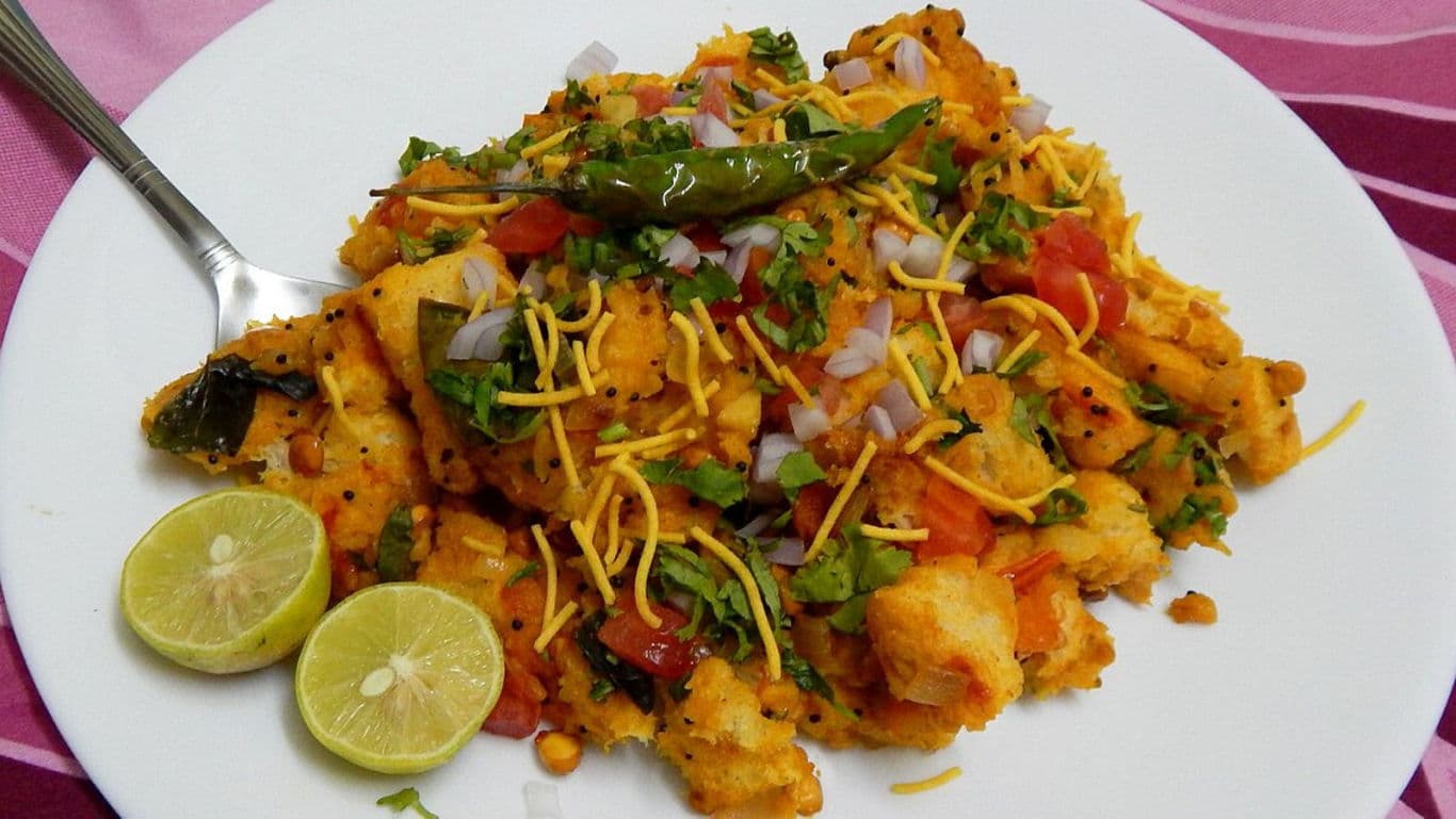 Spicy Indian street food with lime garnish