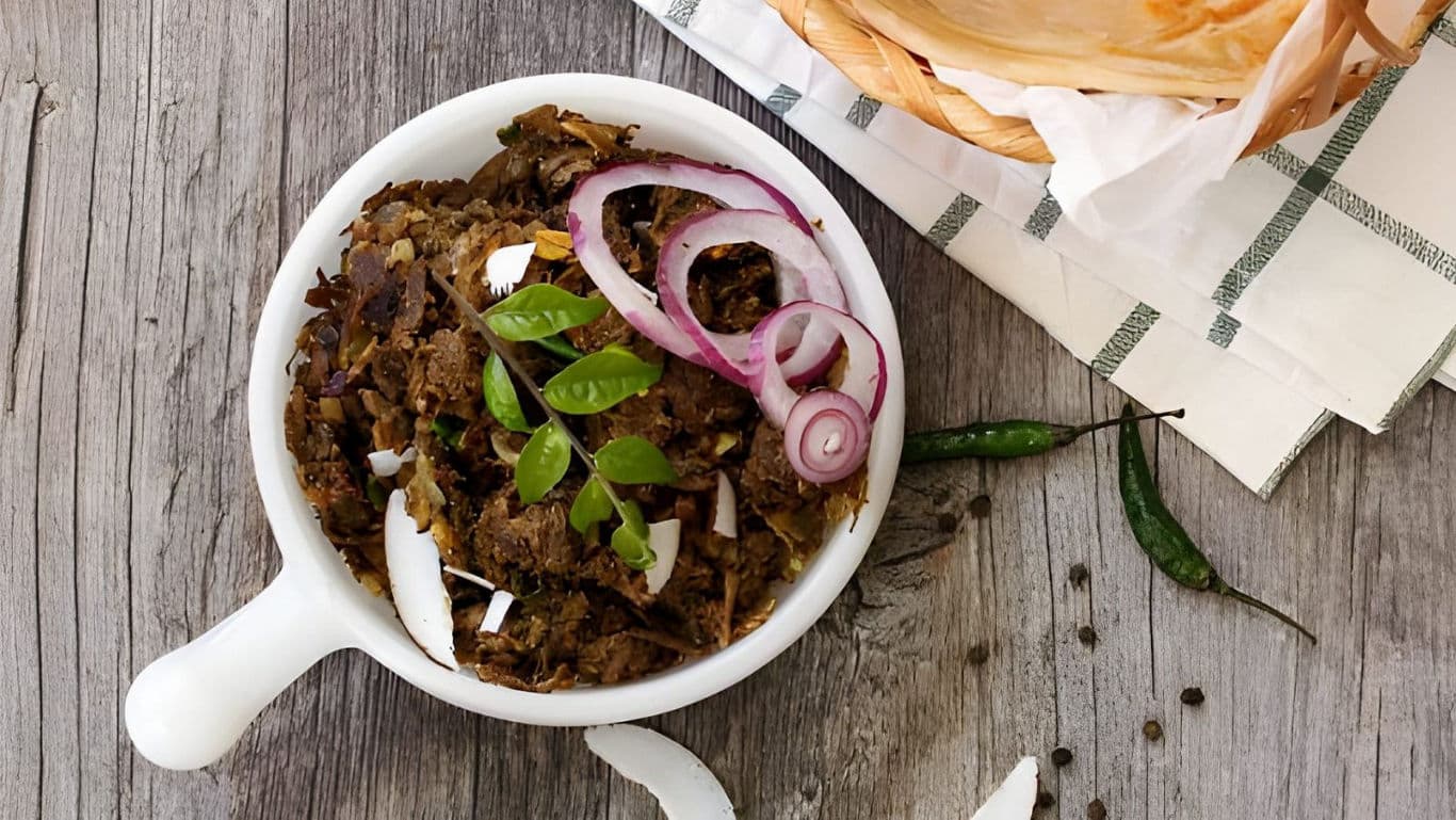 Spiced meat stir fry with onions and herbs served