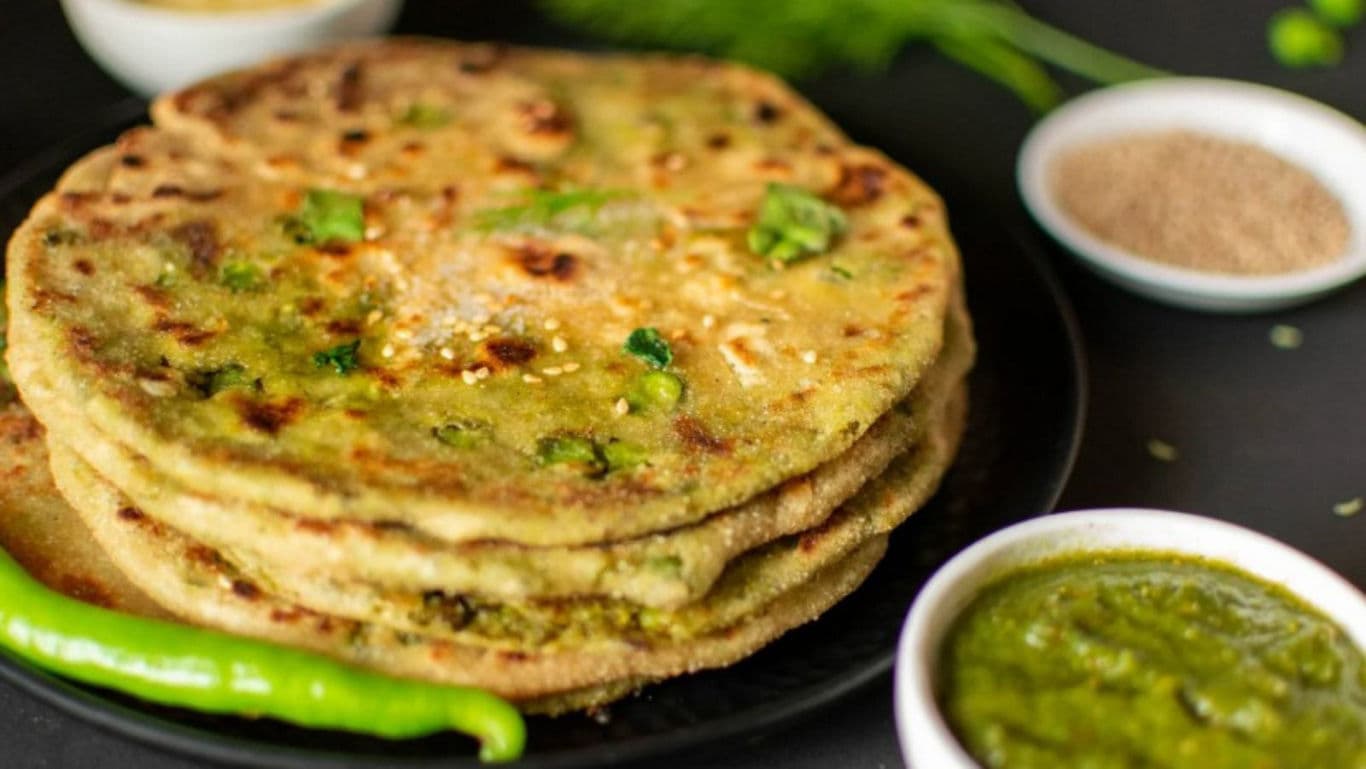 Stack of Indian flatbreads with chutney