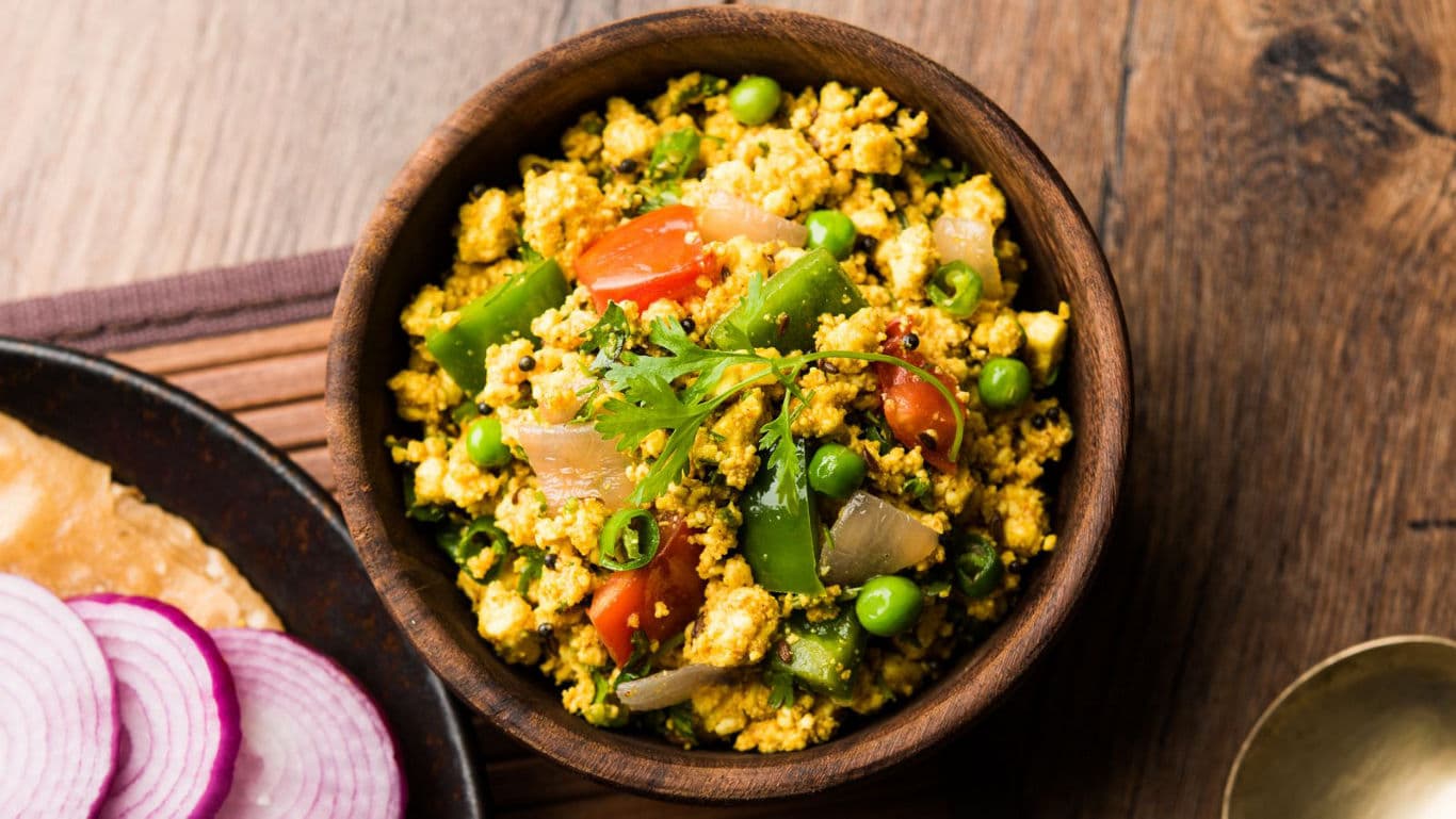 Colorful vegetable curry in wooden bowl