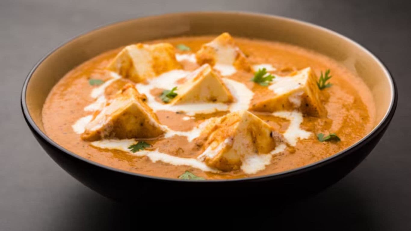 Creamy paneer curry in black bowl