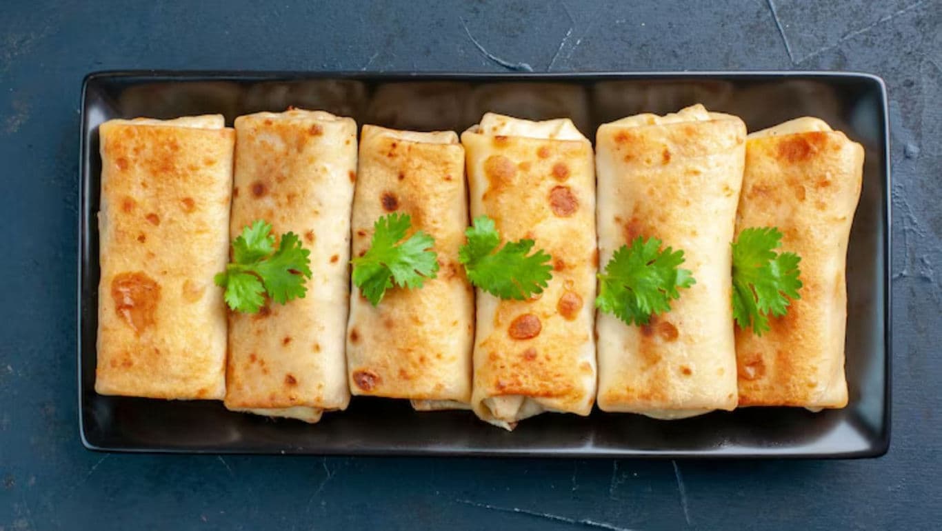 Golden crepes with fresh cilantro garnish