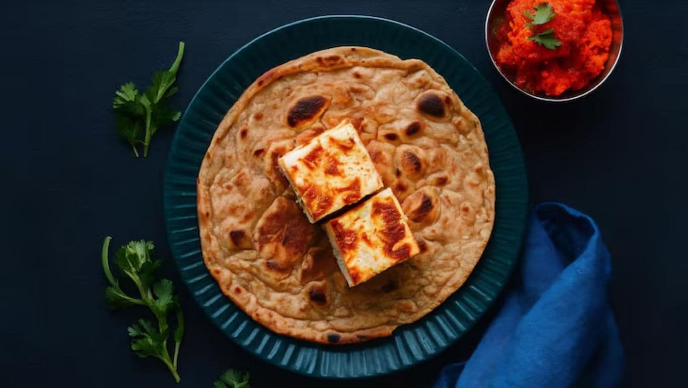 Grilled paneer on flatbread with garnish