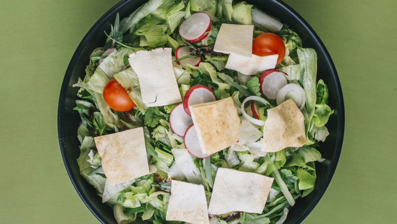 Fresh vegetable salad with pita bread