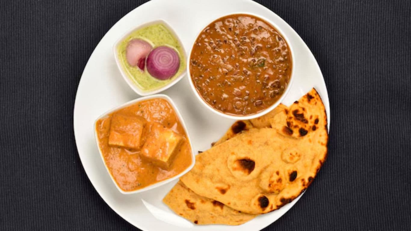 Indian meal with naan and curries