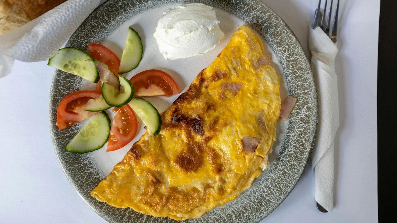 Paneer omelette with salad and sour cream