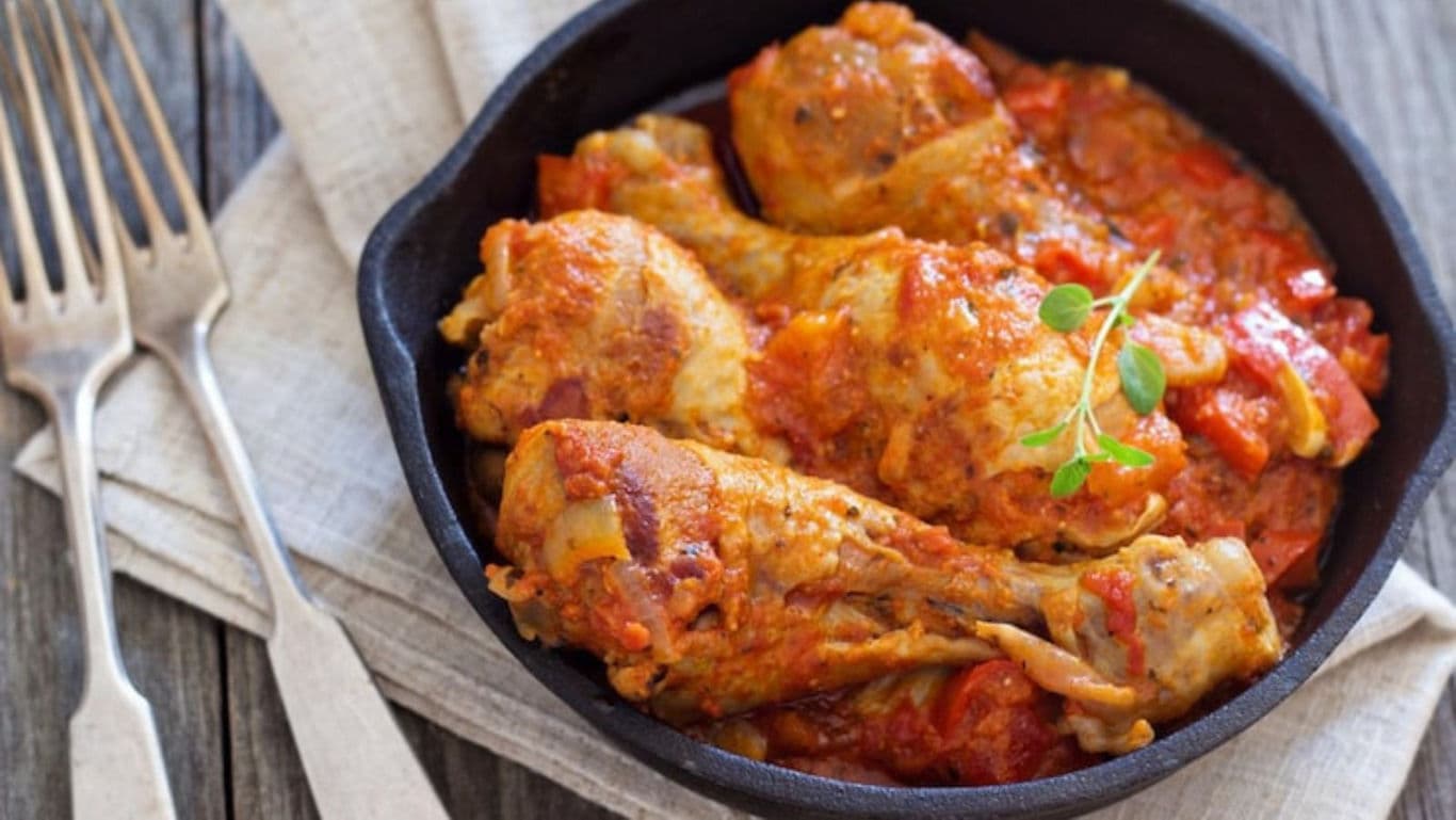 Rustic chicken stew in cast iron skillet