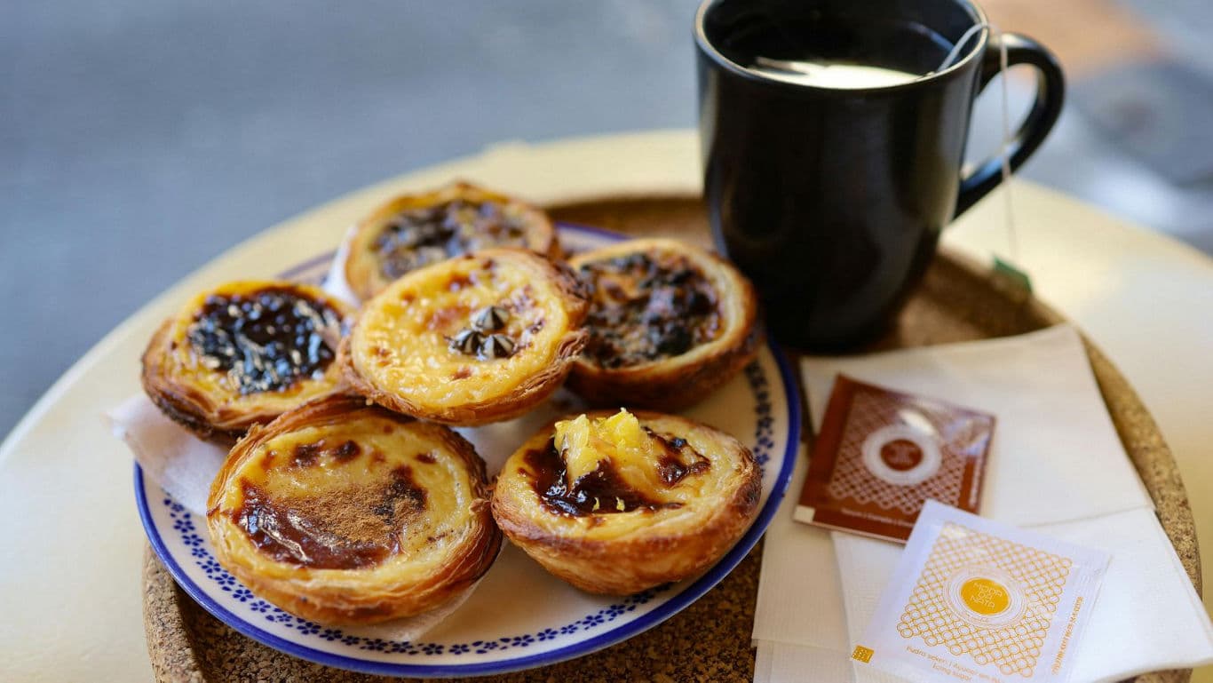 Portuguese custard tarts with coffee