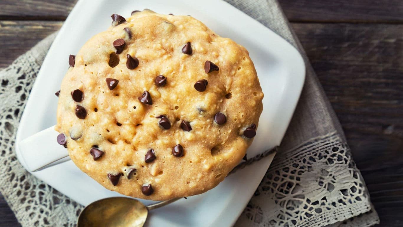 Chocolate chip muffin on white plate