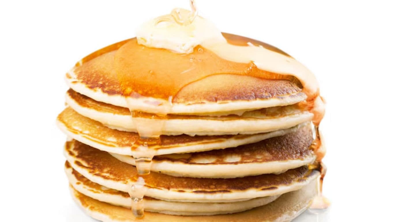 Stack of pancakes with syrup and butter