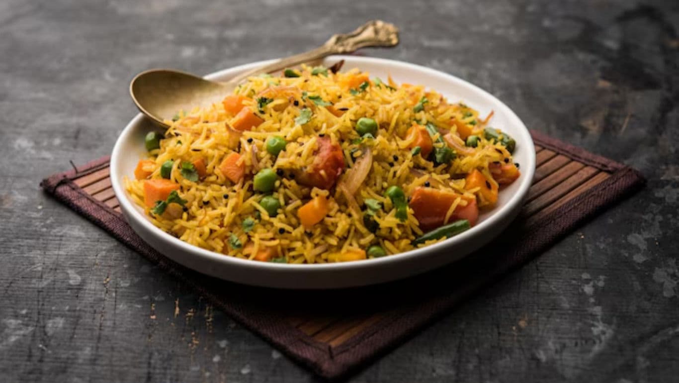 Vegetable Pulao in White Bowl with Spoon
