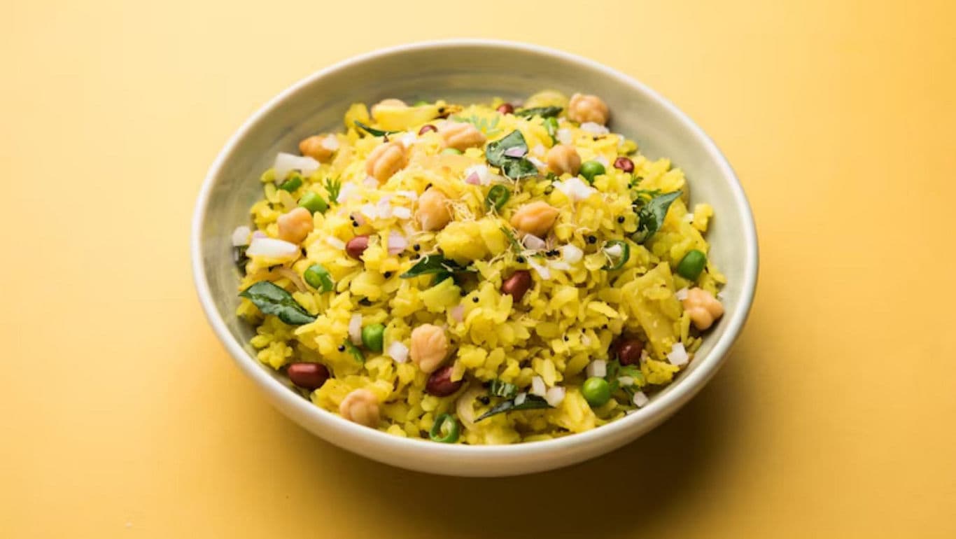 Bowl of vibrant Indian poha dish