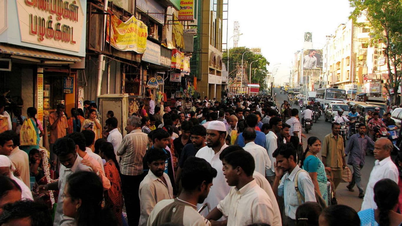 Crowded urban street with bustling activity