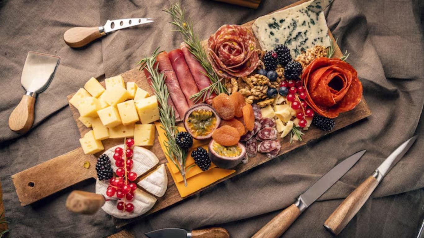 Gourmet charcuterie board with cheese and fruits