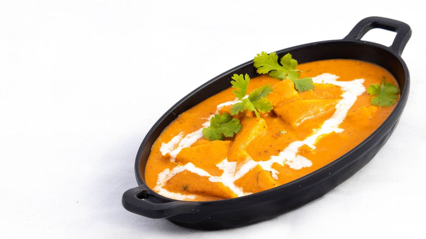 Creamy curry dish with garnish