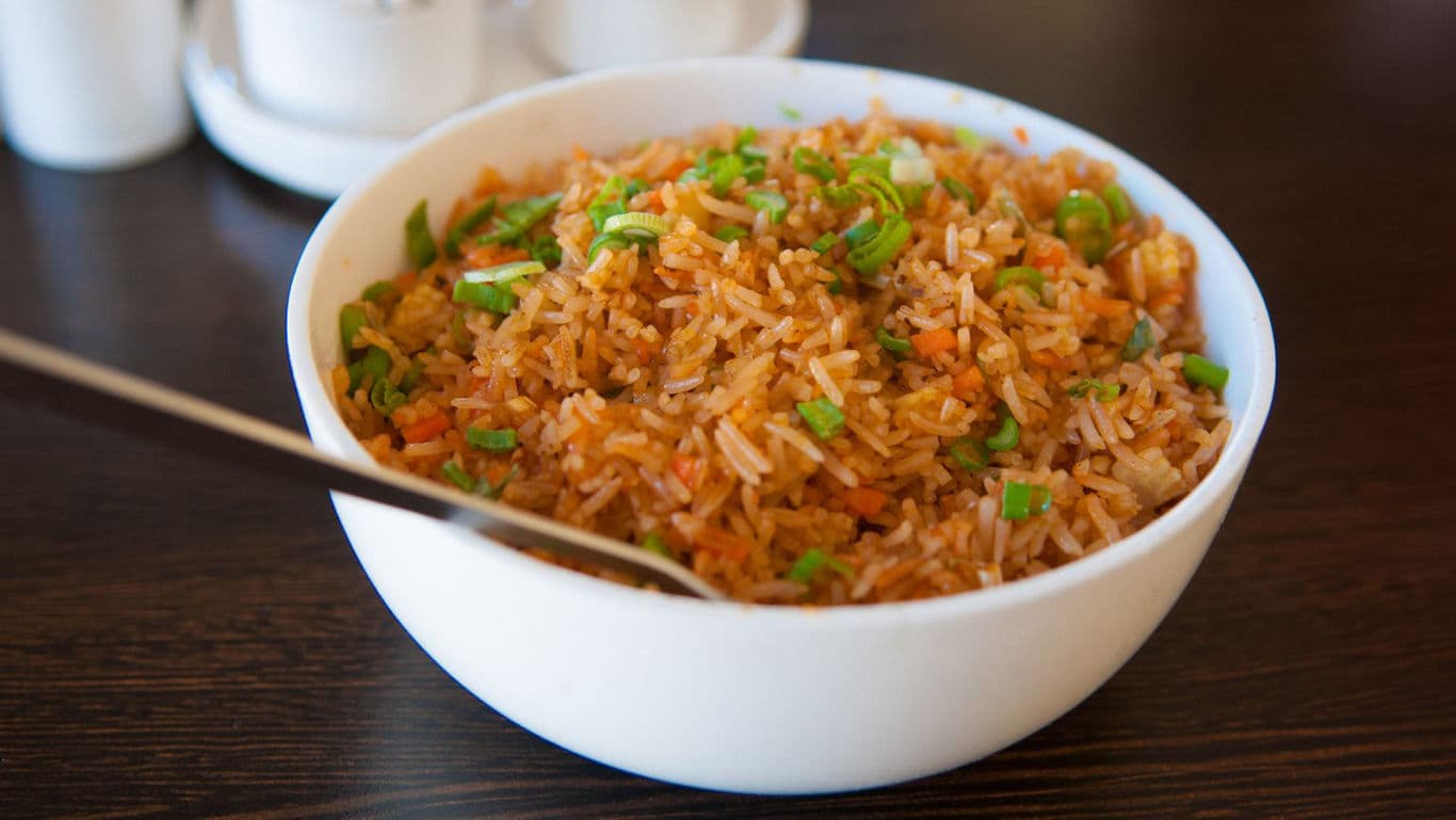 Bowl of fried rice with vegetables