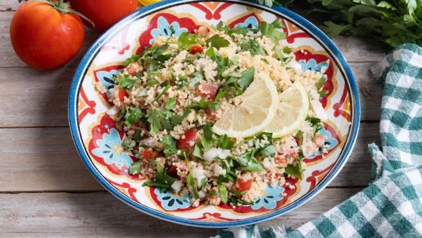 Fresh tabbouleh salad with lemon garnish