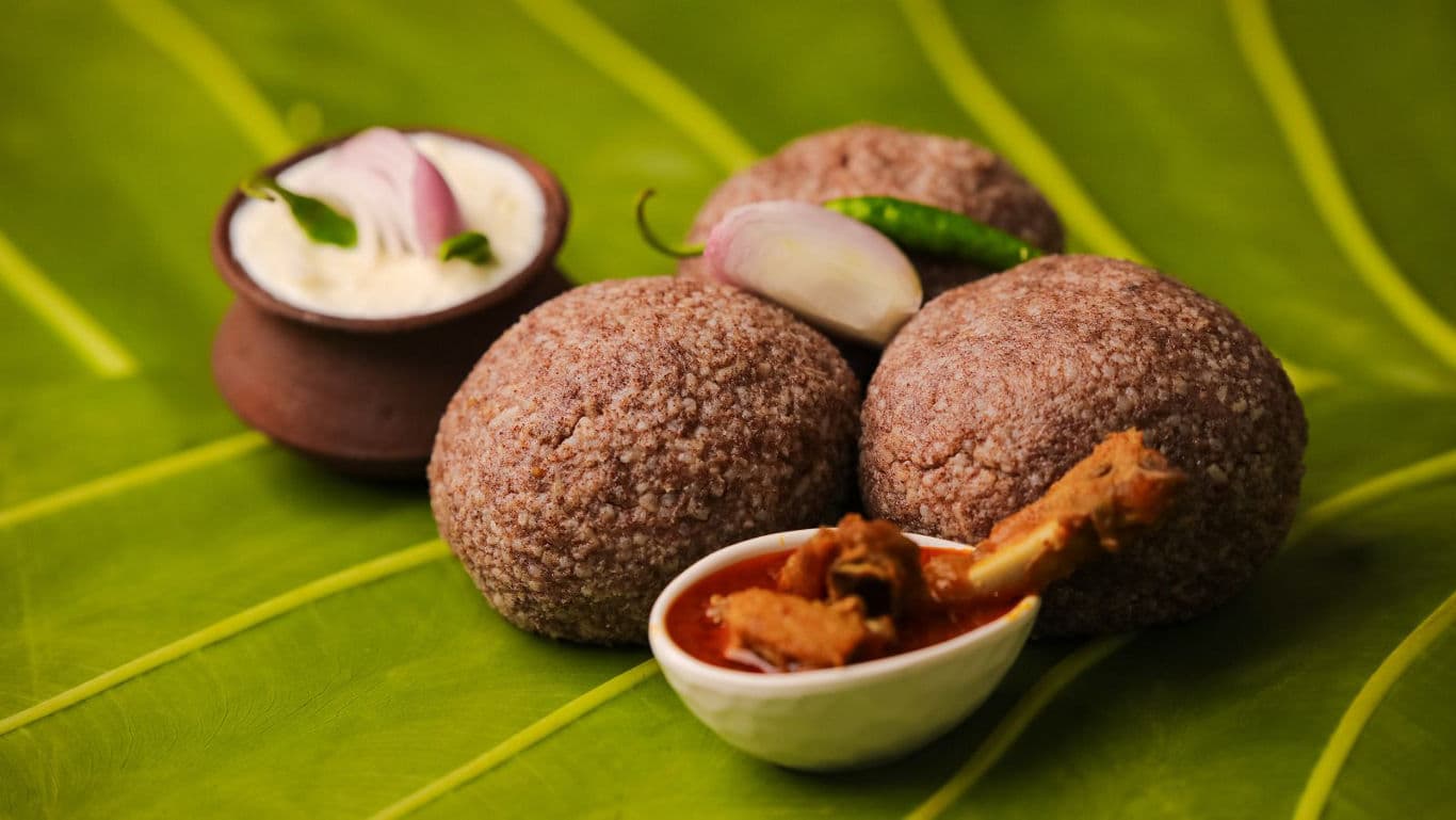Traditional millet balls with curry and yogurt