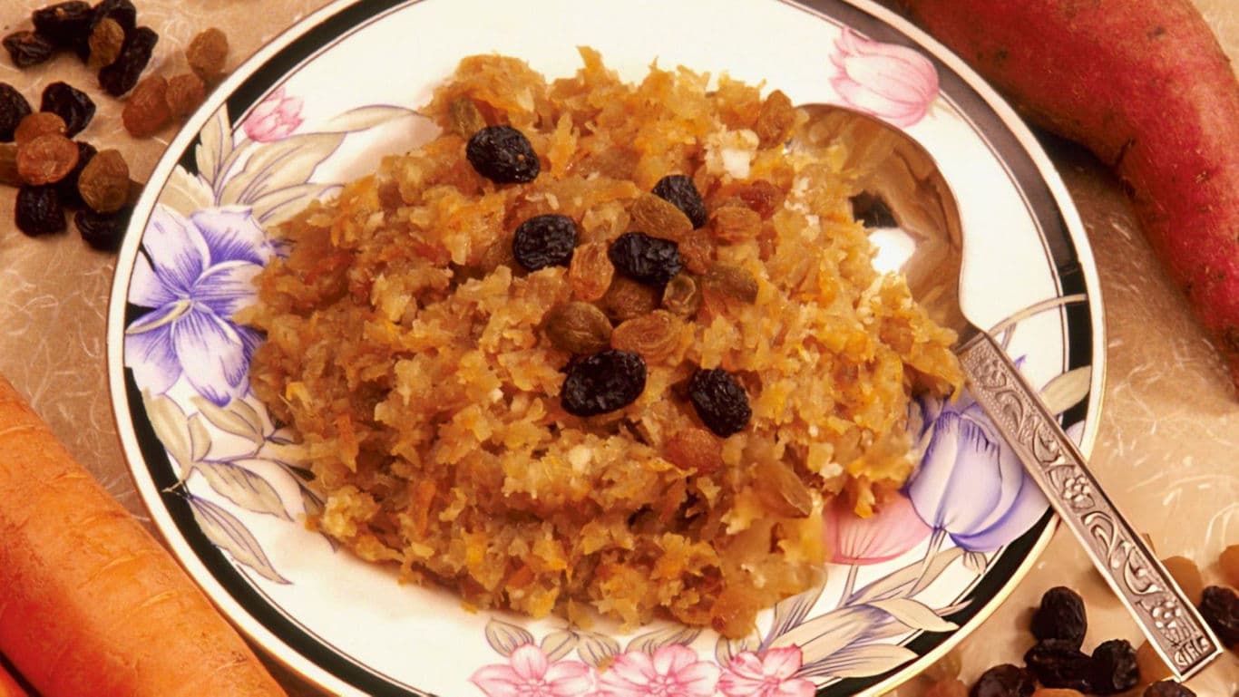 Sweet carrot dessert with raisins on plate