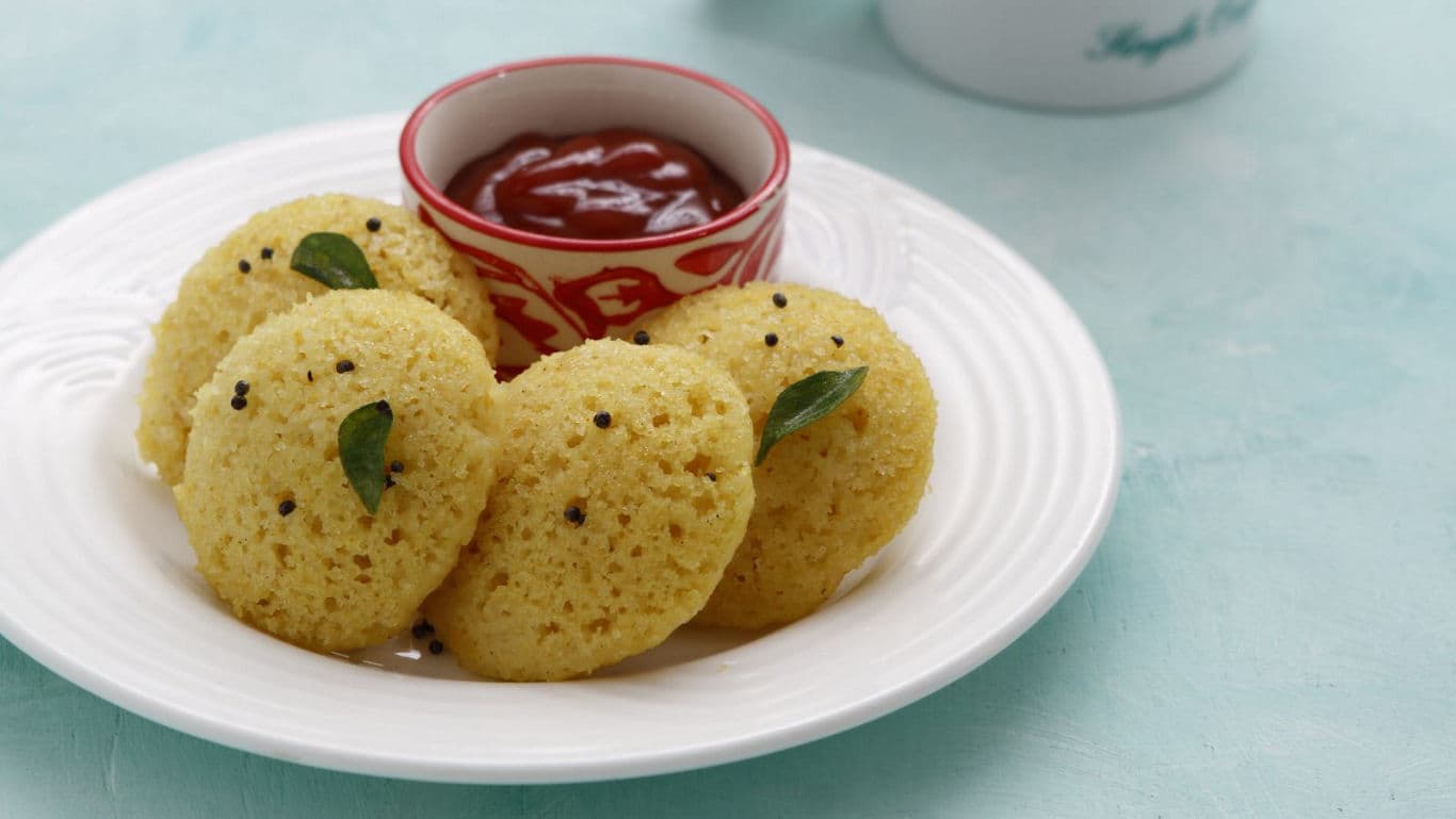 Steamed savory cakes with dip on plate