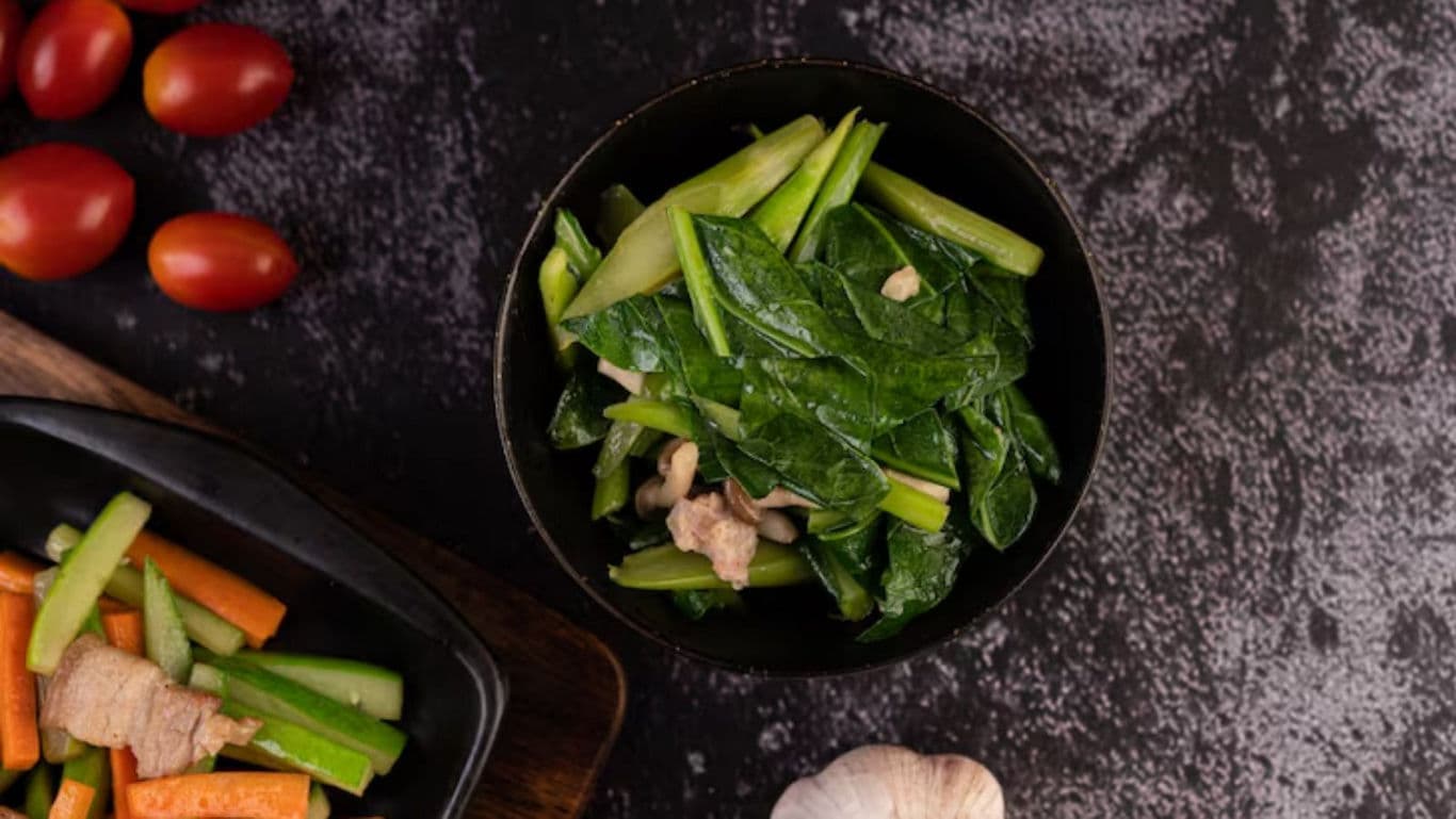 Fresh vegetable stir fry with leafy greens and garlic
