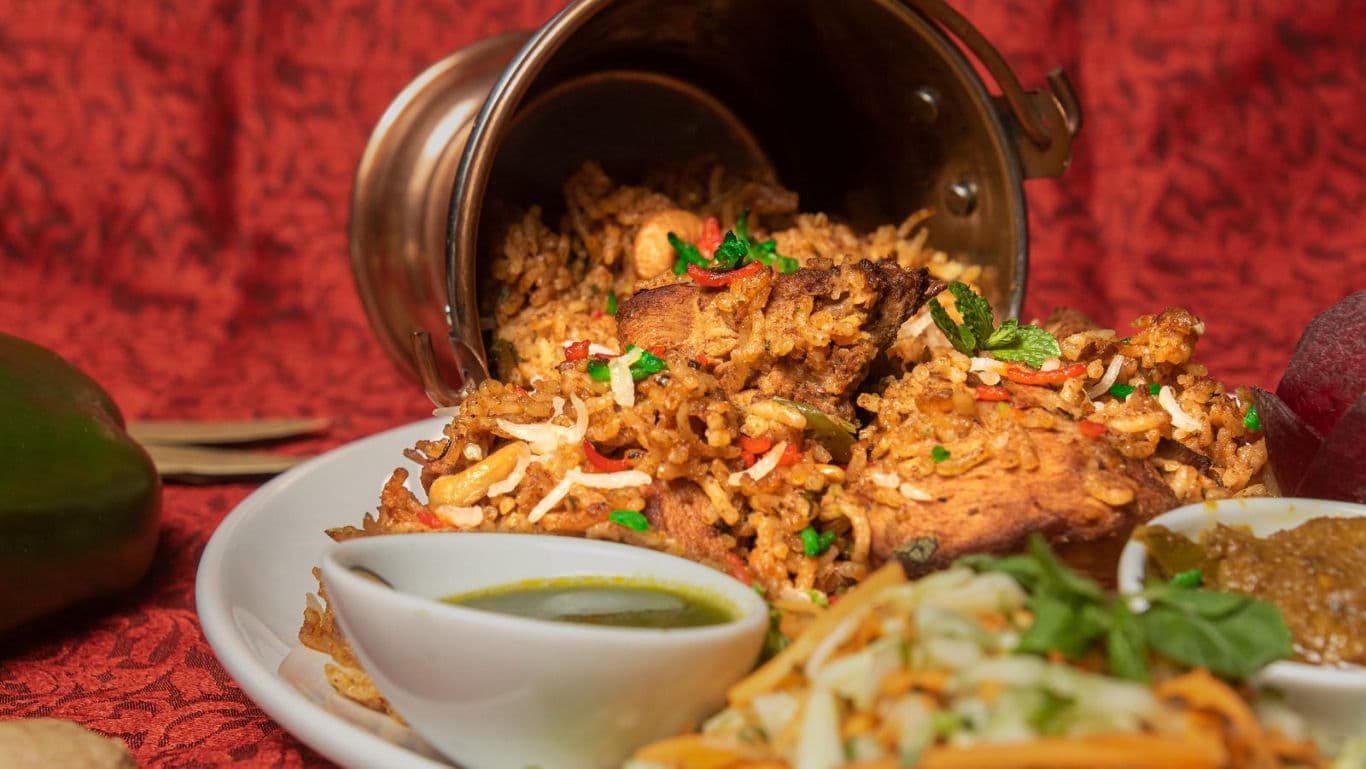 Spicy biryani served with chutneys