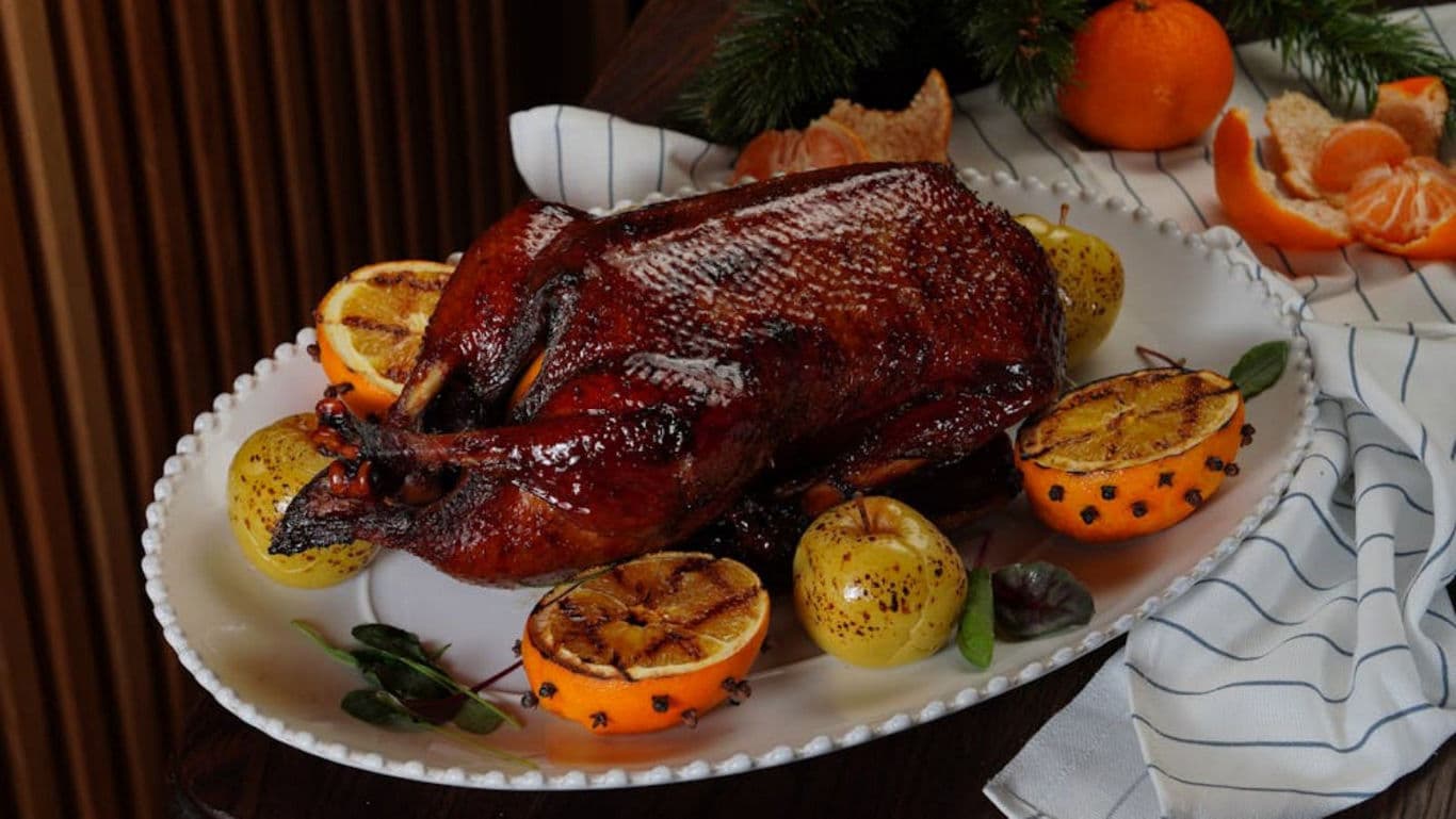 Roasted chicken on table - banner image