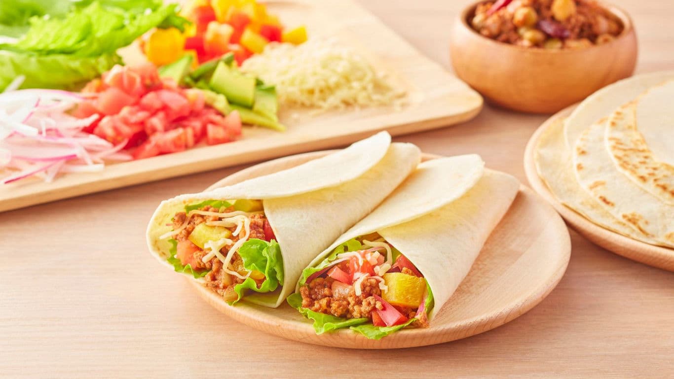 Fresh tacos with assorted vegetables and toppings