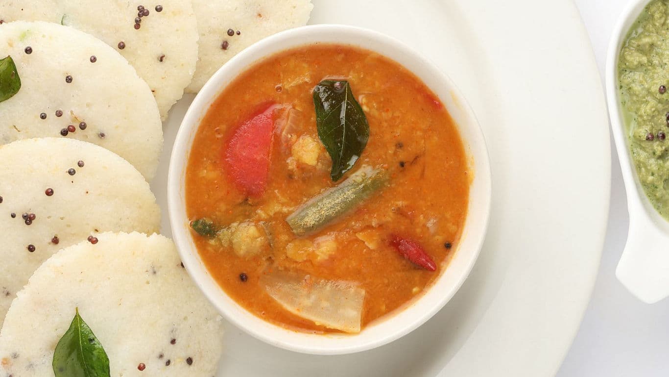 South Indian idli with sambar and chutney on plate