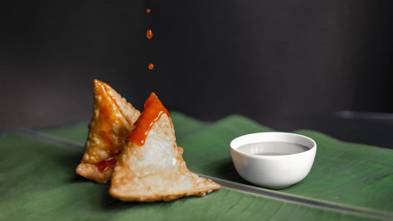 Crispy samosas with dipping sauce