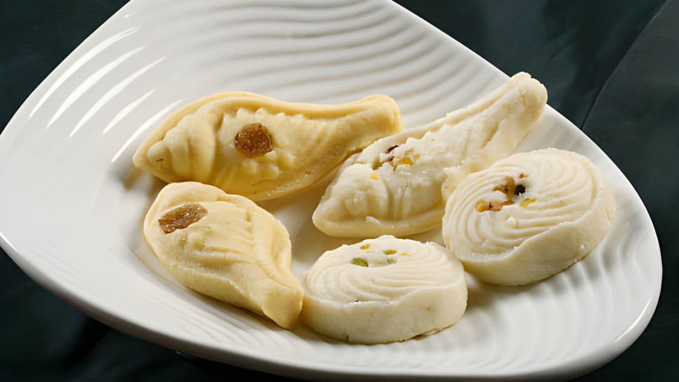 Traditional Indian sweets on white plate