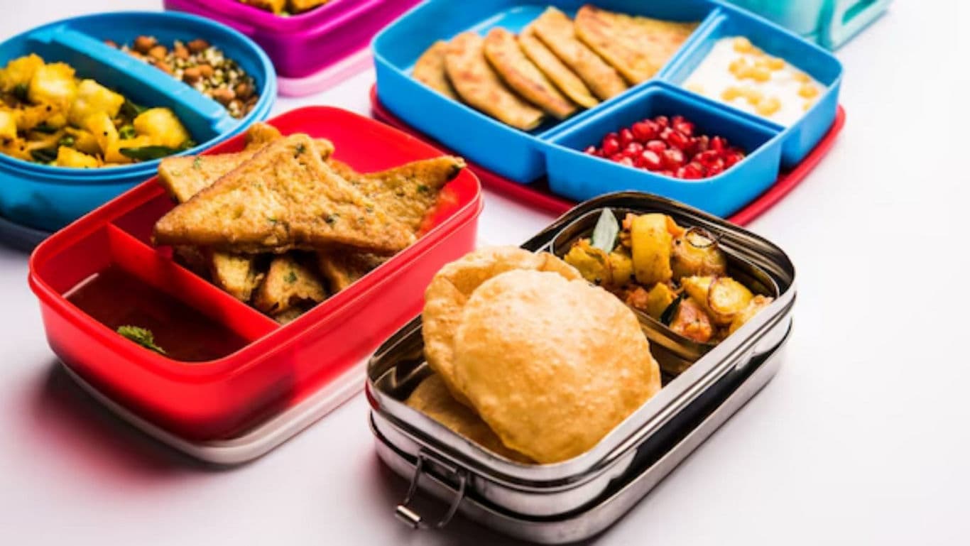Colorful lunchboxes with Indian meals