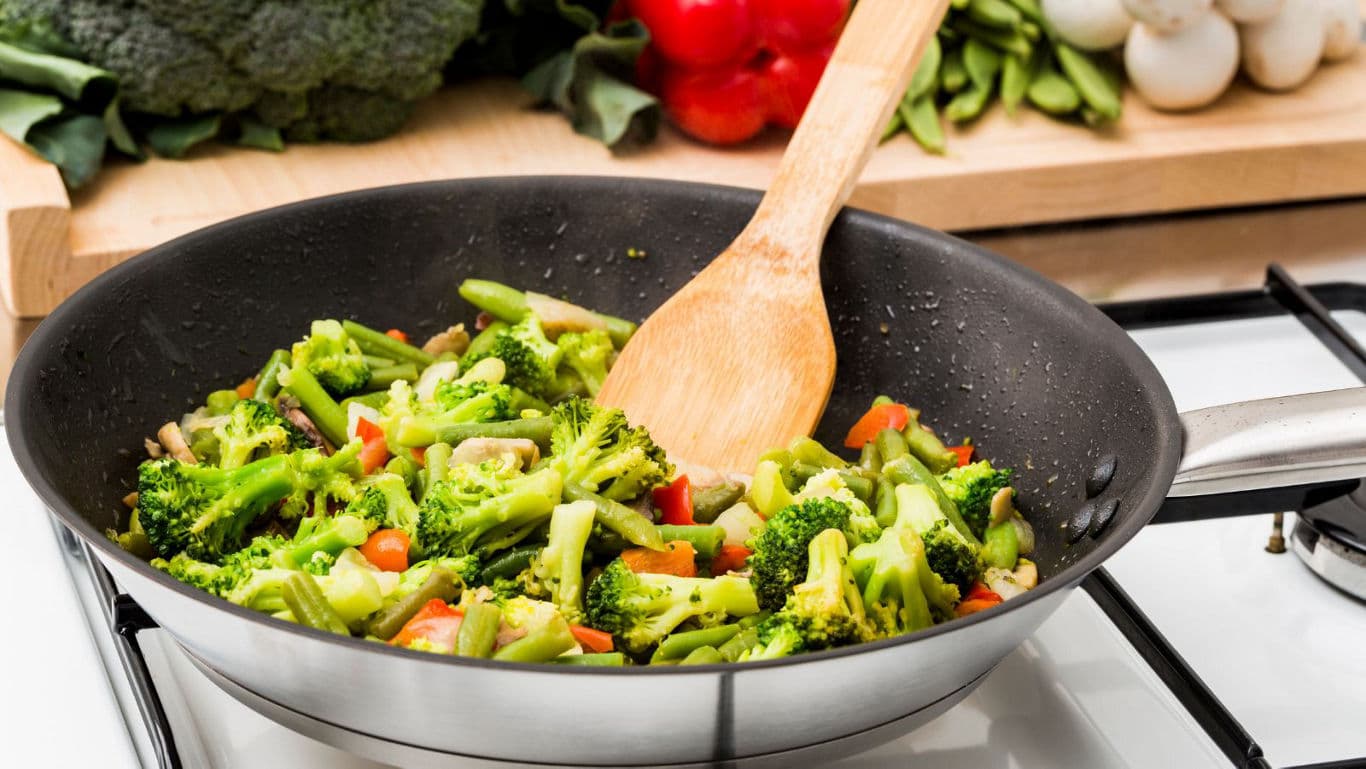 Fresh vegetable stir fry cooking in pan