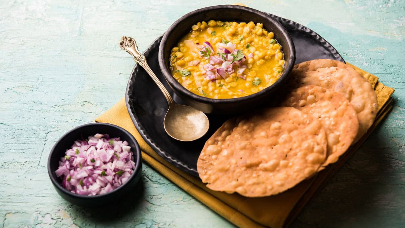 Indian lentil curry with crispy papad