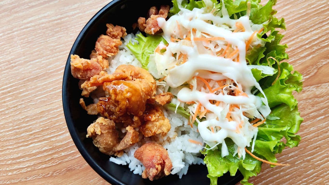 Fried chicken rice bowl with salad