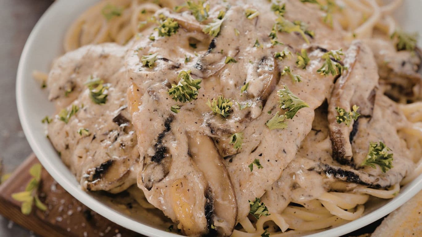 Creamy mushroom chicken pasta with herbs