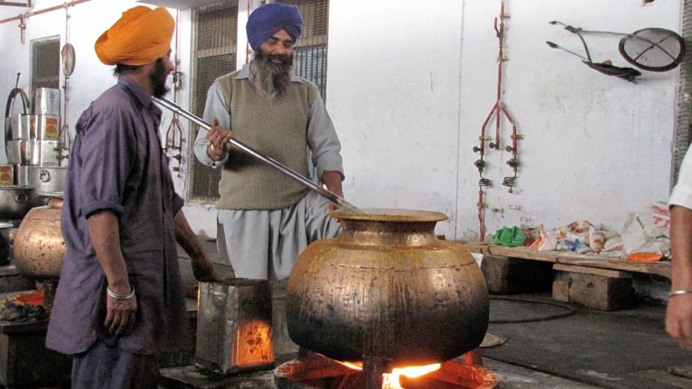 Sikh men cooking for langar