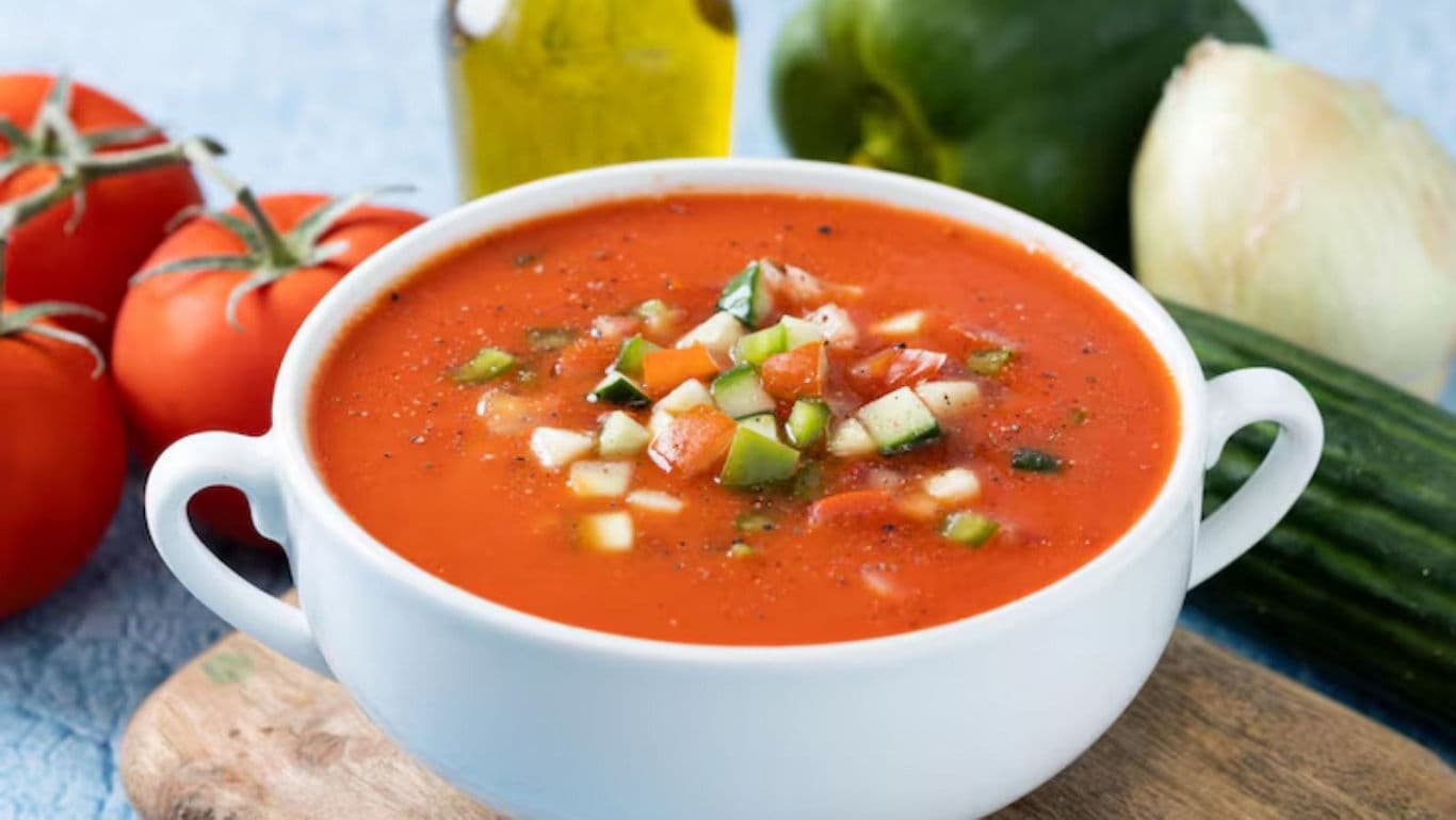 Fresh vegetable gazpacho in white bowl