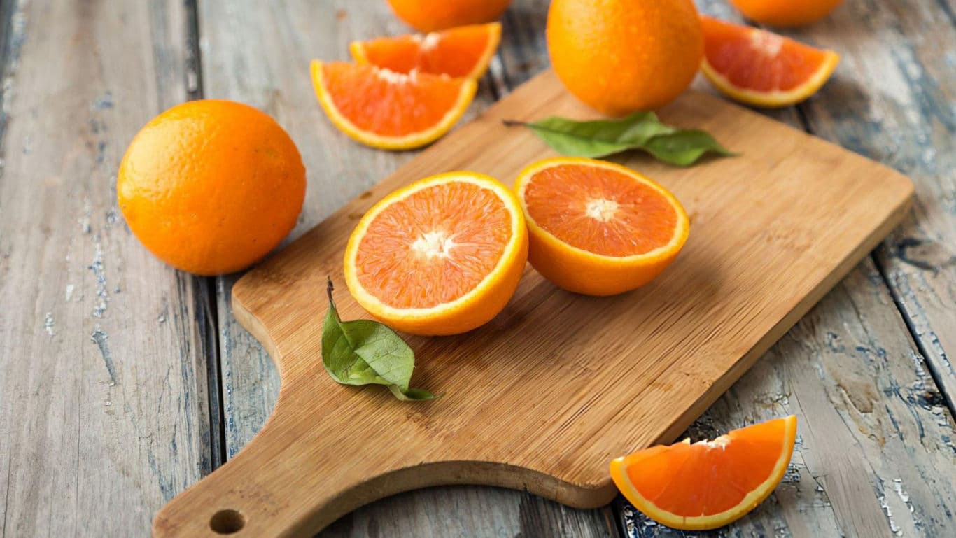 Oranges on a chopping board